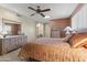 Bright bedroom with a queen bed and vanity area at 13416 N Cedar Dr, Sun City, AZ 85351