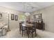 Formal dining room with a wood table, chairs, and a mid-century modern buffet at 13416 N Cedar Dr, Sun City, AZ 85351