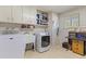 Laundry room with washer, dryer, and storage cabinets at 13416 N Cedar Dr, Sun City, AZ 85351