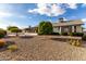 Spacious backyard with gravel and trees at 13907 W Terra Vista Dr, Sun City West, AZ 85375