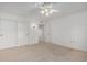 Bedroom with double door closet and ceiling fan at 13907 W Terra Vista Dr, Sun City West, AZ 85375