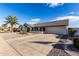 Single-story home with a two-car garage and landscaping at 13907 W Terra Vista Dr, Sun City West, AZ 85375