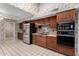 Kitchen with stainless steel appliances and wood cabinets at 13907 W Terra Vista Dr, Sun City West, AZ 85375