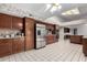 Kitchen features wood cabinets, stainless steel appliances, and tile floors at 13907 W Terra Vista Dr, Sun City West, AZ 85375