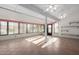 Bright sunroom with tile floor and ceiling fan at 13907 W Terra Vista Dr, Sun City West, AZ 85375