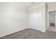 Bright bedroom featuring a double-door closet at 1402 W Hess Ave, Coolidge, AZ 85128