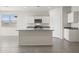 Modern kitchen featuring island, granite countertops, and white cabinets at 1402 W Hess Ave, Coolidge, AZ 85128