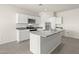 Modern kitchen with white cabinets, granite countertops, and island at 1402 W Hess Ave, Coolidge, AZ 85128