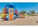 Modern playground equipment in sandy area at 1402 W Hess Ave, Coolidge, AZ 85128