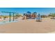 Modern playground with swings, climbing structures, and play area at 1402 W Hess Ave, Coolidge, AZ 85128