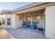 Covered patio with comfortable seating and ceiling fan at 14309 W Rico Dr, Sun City West, AZ 85375