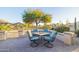 Inviting patio with comfortable seating and a fire pit at 14309 W Rico Dr, Sun City West, AZ 85375