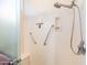 Large shower with built in seat and grab bars at 14309 W Rico Dr, Sun City West, AZ 85375