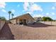 Backyard view of house with covered patio at 14848 W Edgemont Ave, Goodyear, AZ 85395