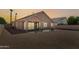 Covered patio with gravel yard and modern two story home at 14848 W Edgemont Ave, Goodyear, AZ 85395