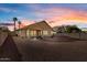 Spacious backyard with gravel and sunset view at 14848 W Edgemont Ave, Goodyear, AZ 85395