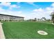 Large grassy lawn with modern building in the background at 14848 W Edgemont Ave, Goodyear, AZ 85395