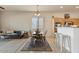 Casual dining area with kitchen and living room views at 14848 W Edgemont Ave, Goodyear, AZ 85395