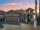 Two story home with two car garage and landscaped yard at 14848 W Edgemont Ave, Goodyear, AZ 85395