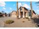 Two-story home with a three-car garage and desert landscaping at 14848 W Edgemont Ave, Goodyear, AZ 85395