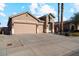 House exterior with two car garage and landscaping at 14848 W Edgemont Ave, Goodyear, AZ 85395