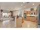 Open concept kitchen with island and stainless steel appliances at 14848 W Edgemont Ave, Goodyear, AZ 85395