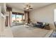 Spacious living area features a fireplace and sliding glass doors at 14848 W Edgemont Ave, Goodyear, AZ 85395