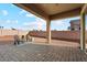 Covered patio with pavers and seating area at 14848 W Edgemont Ave, Goodyear, AZ 85395