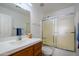 Bathroom with shower/tub combo and wood vanity at 15819 W Crocus Dr, Surprise, AZ 85379