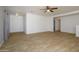 Living room with tile floor and ceiling fan at 15819 W Crocus Dr, Surprise, AZ 85379