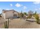 Landscaped backyard with gravel and desert plants at 15920 W Summerwalk Dr, Surprise, AZ 85374