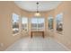 Bright breakfast nook with window seating and tile floors at 15920 W Summerwalk Dr, Surprise, AZ 85374