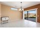 Bright dining room with sliding door to backyard at 15920 W Summerwalk Dr, Surprise, AZ 85374