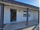 Modern front entrance with a covered porch and stylish door at 1633 N 62Nd Ave, Phoenix, AZ 85035