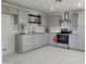 Modern kitchen with gray cabinets and granite countertops at 1633 N 62Nd Ave, Phoenix, AZ 85035