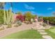 Landscaped backyard with stone steps and desert landscaping at 1646 W Ainsworth Dr, Anthem, AZ 85086