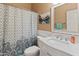 Clean bathroom with shower/tub combo and marble vanity at 1646 W Ainsworth Dr, Anthem, AZ 85086