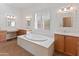 Spa-like bathroom with soaking tub, double vanities, and large mirrors at 1646 W Ainsworth Dr, Anthem, AZ 85086