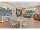 Bright dining area with a table and chairs, adjacent to living room at 1646 W Ainsworth Dr, Anthem, AZ 85086