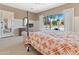 Main bedroom with French doors to backyard and a king-size bed at 1646 W Ainsworth Dr, Anthem, AZ 85086