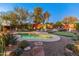 Expansive backyard oasis with a sparkling pool and putting green at 1646 W Ainsworth Dr, Anthem, AZ 85086