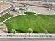 Arial view showing a community park with expansive green lawns at 18381 W Gray Fox Trl, Wittmann, AZ 85361