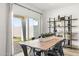 Light-filled dining area with sliding glass doors to backyard at 18381 W Gray Fox Trl, Wittmann, AZ 85361