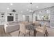 Open concept dining area with modern chandelier and kitchen views at 19724 N Jojoba Ct, Surprise, AZ 85374