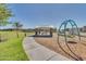 A playground and covered picnic area within a well-maintained neighborhood park setting at 19724 W Palo Verde Dr, Litchfield Park, AZ 85340