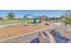 Community park provides recreational space, with swing set, picnic area, and scenic landscaping for community enjoyment at 19724 W Palo Verde Dr, Litchfield Park, AZ 85340