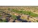 Aerial view of a residential neighborhood with golf course and various homes at 19939 N Golden Barrel Dr, Surprise, AZ 85374