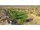 Aerial view showing a golf course and surrounding homes at 19939 N Golden Barrel Dr, Surprise, AZ 85374