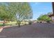 Spacious backyard with golf course views and mature trees at 19939 N Golden Barrel Dr, Surprise, AZ 85374