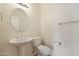 Simple bathroom with pedestal sink and toilet at 19939 N Golden Barrel Dr, Surprise, AZ 85374